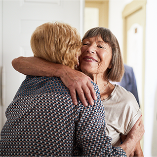 Elderly women embracing each other